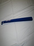 Long handled shoehorn used to assist patients with putting on shoes.