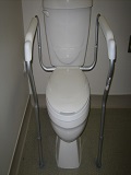 A Versaframe can be attached to a standard toilet seat without arms and can be removed when no longer needed.