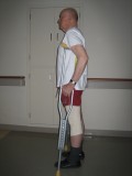 Image of man demonstrating how to use crutches