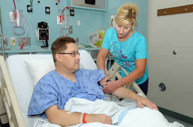 Transplant Unit nurse cares for a patient