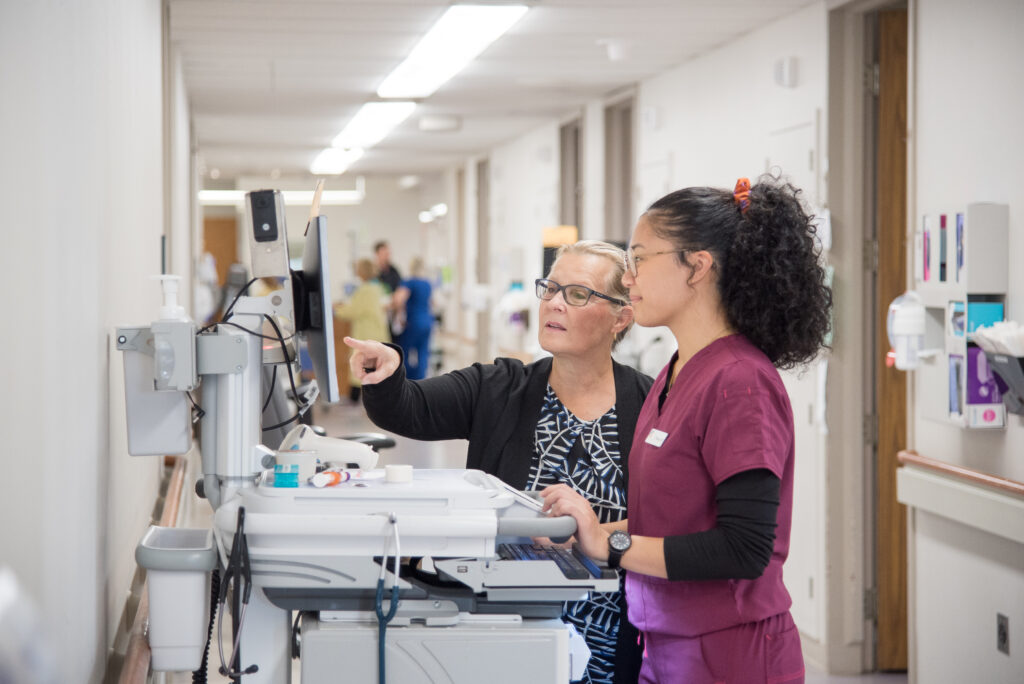 Tara Lyons Cork speaks with Therese De Guzman, a nurse in General Surgery at University Hospital.