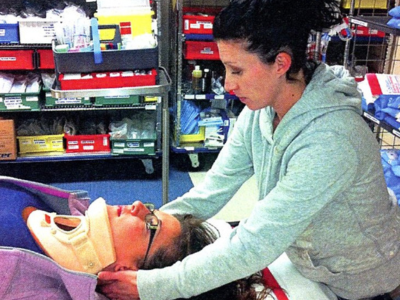 Above: Triage Nurse simulating assessment of low acute neck injury in 2011.
