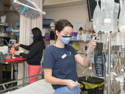Individuals from the Victoria Hospital Emergency Department nursing team are prepping for patients.
