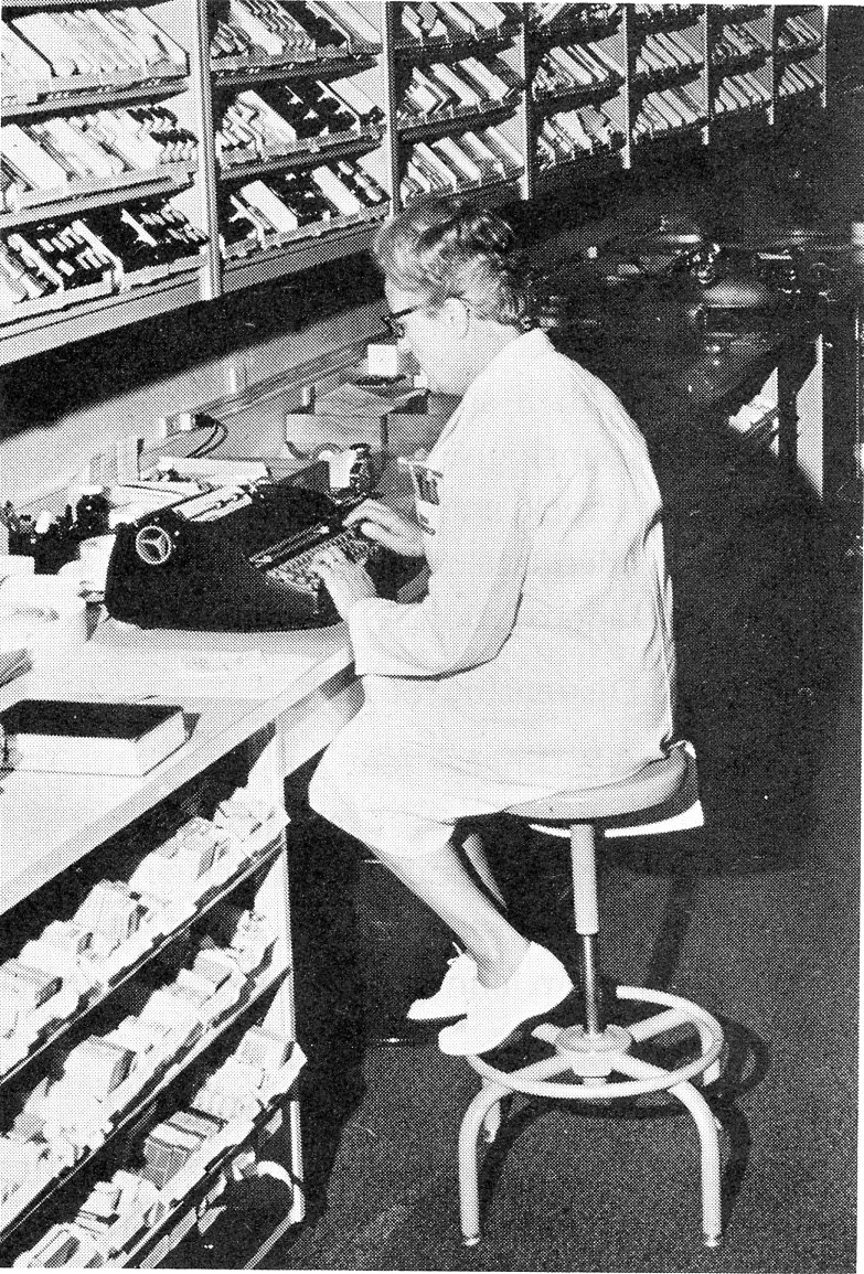 1970, Member of the Pharmacy team using a typewriter in the inpatient dispensing sector.