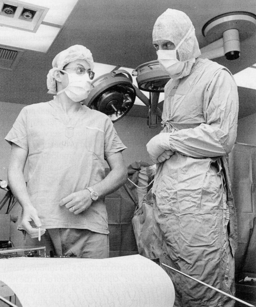 Drs. Rick McLachlan and John Girvin confer about an EEG reading.  