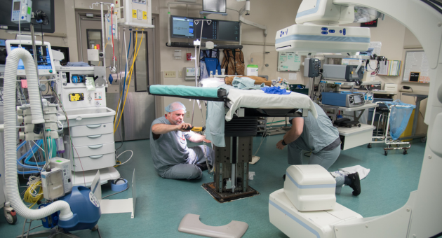 Tables in ORs have changed requiring the need for specialized knowledge. The table shown is a hydraulic surgical table in one of the operating rooms at University Hospital which requires preventative maintenance, quite different from the surgical tables used 100 years previously (picture from 1927).