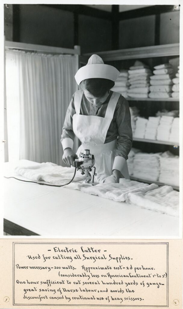 Nurse cutting sterile dressing