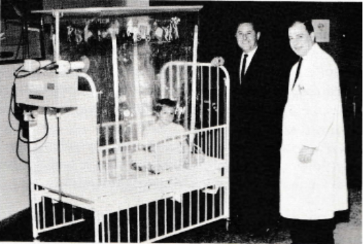 Physicians and patients shown with a croupette, which delivers cooled, humidified oxygen to support children up to age seven with pneumonia, croup, and other respiratory conditions.