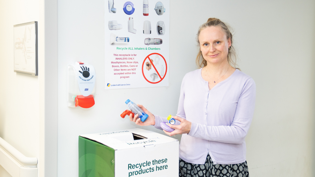 Dr. Constance Mackenzie, a respirologist at LHSC and St. Joseph's Health Care London, stands in front of the new inhaler recycling box in the LHSC Respirology Clinic.