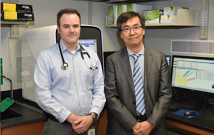 Dr. John Lenehan and Dr. Richard Kim pictured standing together. 