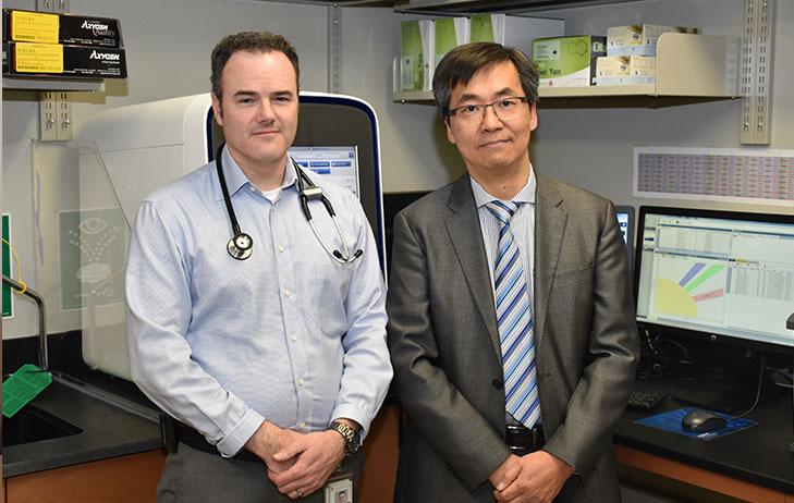 Dr. John Lenehan and Dr. Richard Kim pictured standing together. 