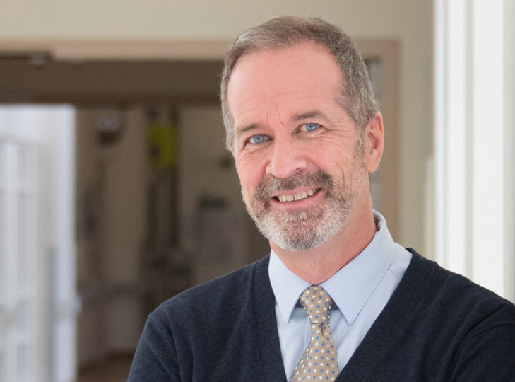 President and CEO Dr. Paul Woods pictured smiling. 