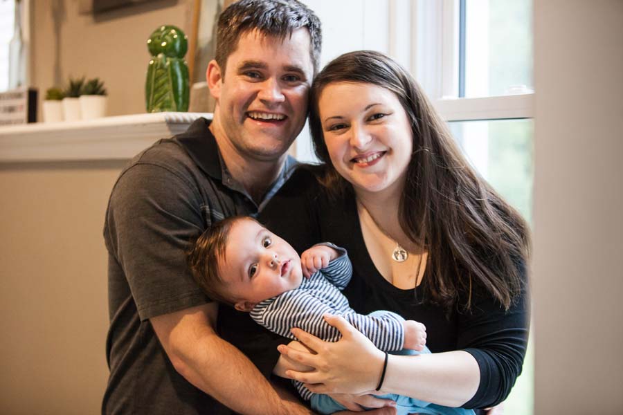 Glen Backwell and Beth French holding their son, Charles.