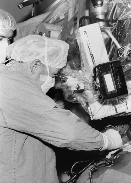 CNS co-founder and world-renown surgeon, Dr. Charles Drake, performs surgery in 1982.