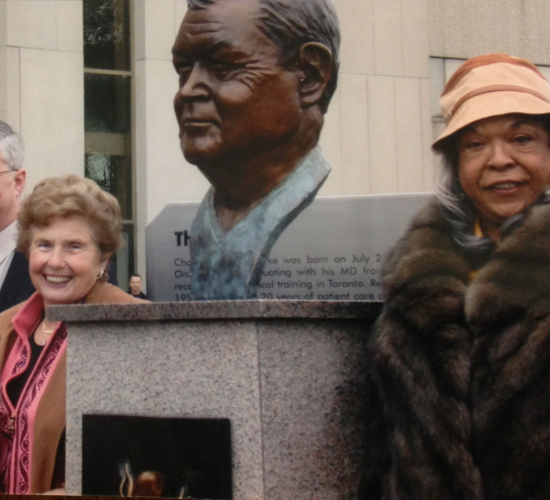 A bust of Dr. Charles Drake located at the entrance of University Hospital was unveiled in 2003 by his wife, Ruth, (left) and singer and actress Della Reese (right).