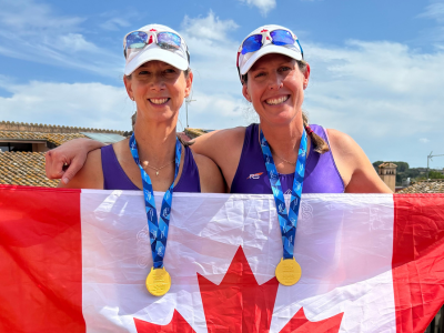 Pictured: Carolyn Jaeger and Andrea Mutsaers holding up a Canadian flag