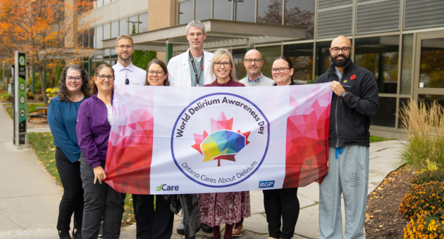 Team members hold the delirium flag