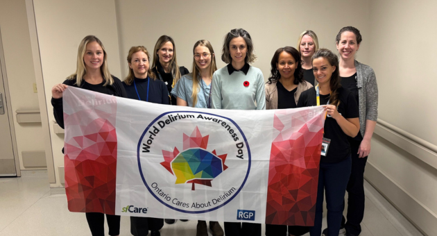 Team members hold the delirium flag