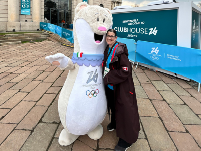 Dr. Jevremovic and Milano Cortina Olympic mascot, Tina.