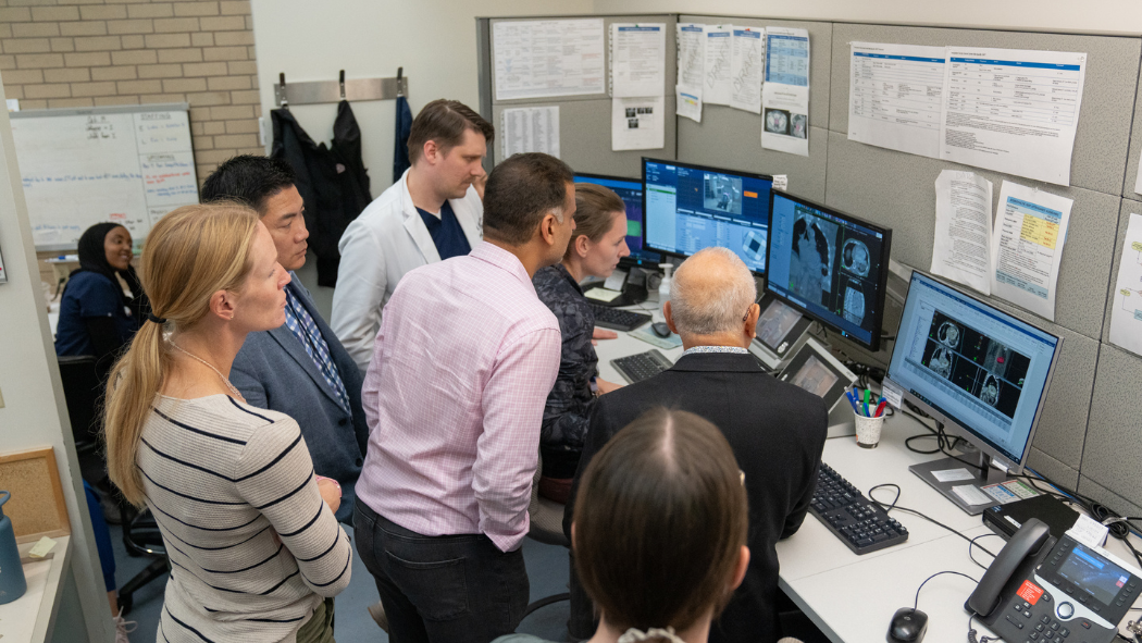 Dr. Tang and a multidisciplinary team monitoring the progression of the radiation treatment