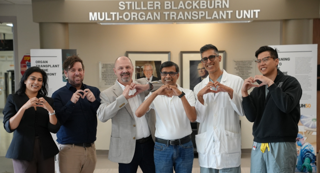 Members of LHSC's Cardiac Transplant team are pictured making heart hands with patient Raj Mittal