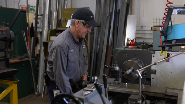 Walter works on the lathe.