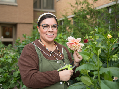 Nicole Yawney, Youth Indigenous Wellness Consultant, stands in the Victoria Hospital Indigenous Healing Garden