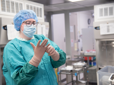 technician puts on rest of the gloves
