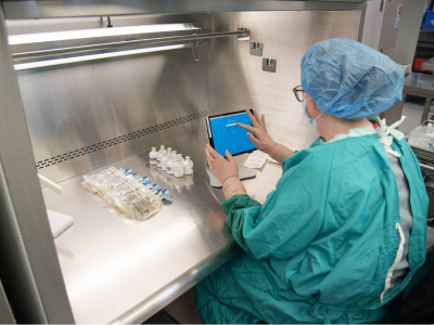 technician at bench using iPad