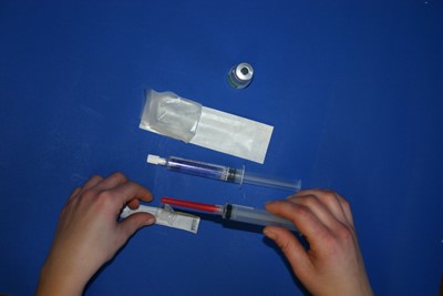 Attach Blunt Fill Needle to 10 cc syringe. Remove syringe from package and attach the Blunt Fill Needle.
