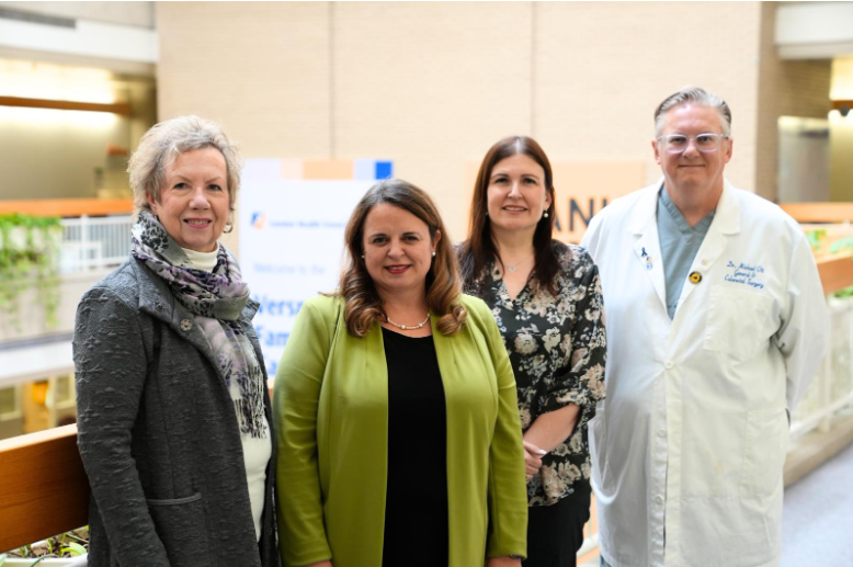 Linda Cottell, Tammy Quigley, Carey Landry and Dr. Michael Ott standing in front of London Health Sciences Centre atrium.