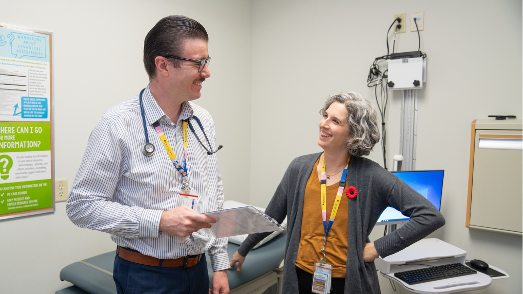 Nurse Practitioners Matthew Parezanovic and Sari Belzycki talking in the clinic.