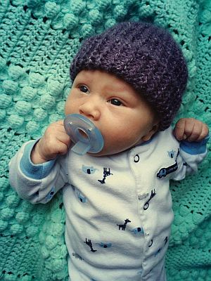 Baby boy with purple cap