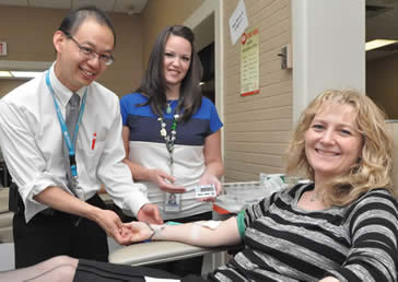 Jill Craven (right), Director of Cancer Services at LHSC’s London Regional Cancer Program, donated blood at the launch event for LHSC’s participation in the Canadian Blood Services’ “Partners for Life” program. Also present at the launch were Dr. Ian Chin-Yee, hematologist, and Meaghan Force, an RN in the Critical Care Trauma Program. 