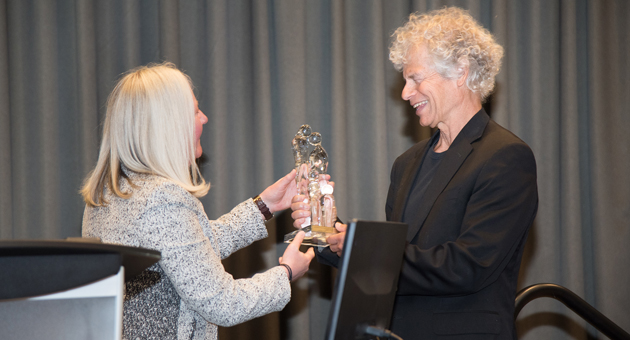 Dr. Margaretha Rebel presents Dr. Jeffrey Nisker with his CFAS Award of Excellence