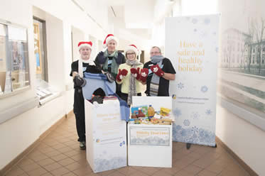 Portering staff at London Health Sciences Centre highlight the contributions of food and warm clothing donated by LHSC staff and physicians.