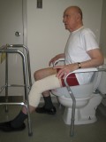 sitting on toilet