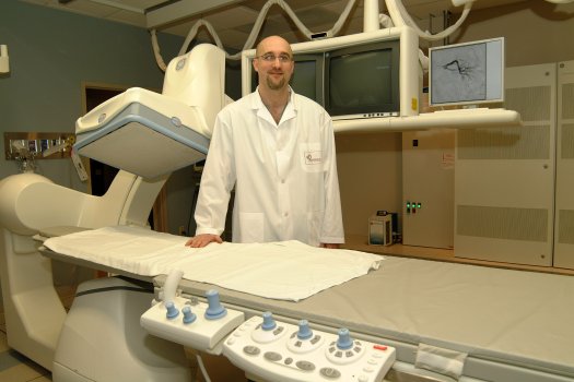 Dr. David Peck, Director of Angiography and Interventional Radiology at LHSC's University Campus, stands by the first GE Innova 4100