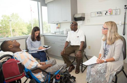 Transition clinic team with patient