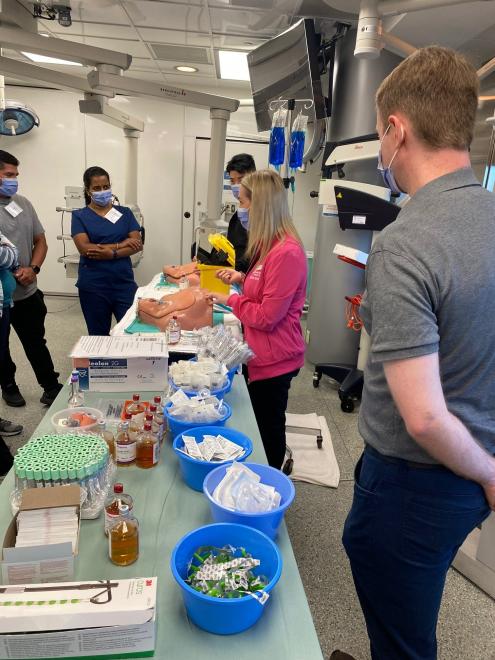 Cassandra Nutkins, Nursing Resource Team Clinical Educator and William Bent, VH Medicine Clinical Educator demonstrate proper technique for blood culture collection.