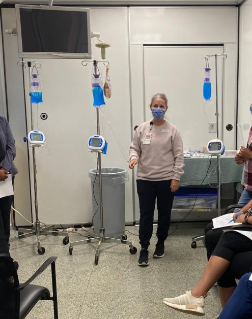 Chrissy Pettit, Ortho/Trauma Clinical Educator, facilitates hands-on training on Kangaroo enteral feeding pumps.