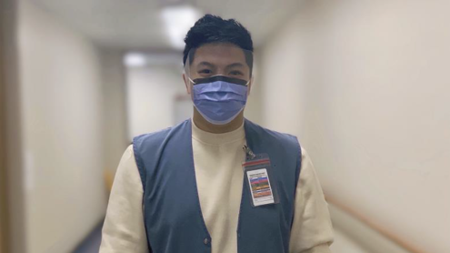 Volunteer wearing a face shield 
