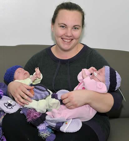 babies in purple hats