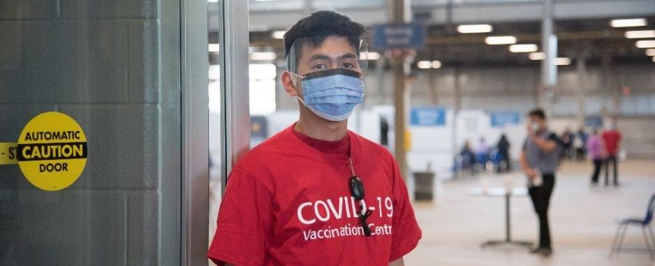 greeter in a red shirt