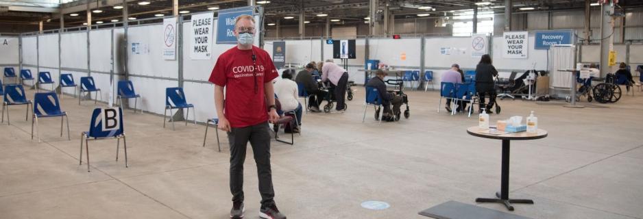 A final greeter directs you to the vaccinator tables