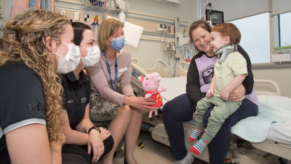 Jessi Baer and Charity Lindsay of the Children’s Hospital Neonatal Paediatric Transport Team, Dr Janice Tijssen and mom Gillian Burnett with son Waylon Saunders.