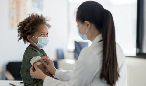 Image of child receiving a vaccine 