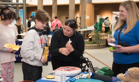 Indigenous students explore the Thames Valley Children's Centre display at the Youth Indigenous Career Fair on February 13, 2024
