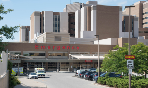 A photo of the Emergency Department entrance at Victoria Hospital on a sunny, spring or summer day.