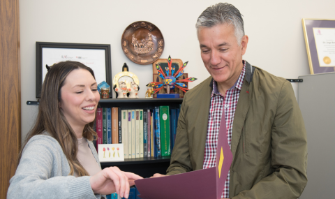 Two researchers reviewing findings.